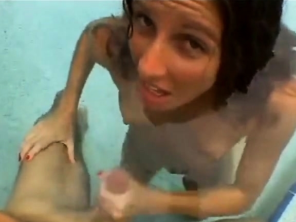 Funny handjob inside swimming pool.